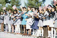 Students greet President Nixon and First Lady Patricia Nixon at Tehran Mehrabad Airport